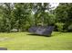 The solar panel is situated on a expansive lawn, offering a sustainable energy solution at 300 Peggy Cole Bridge Rd, Villa Rica, GA 30180