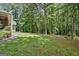 Expansive backyard lawn bordering a densely wooded area, offering a blend of open space and natural beauty at 40 Riverside Pkwy, Sharpsburg, GA 30277