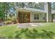 The backyard has a patio and screened in porch perfect for entertaining and enjoying the natural landscape at 40 Riverside Pkwy, Sharpsburg, GA 30277