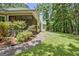 Serene backyard with a screened porch and a concrete patio, perfect for enjoying outdoor living at 40 Riverside Pkwy, Sharpsburg, GA 30277