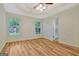 Bedroom with wood flooring, two windows bringing in natural light and bright paint at 40 Riverside Pkwy, Sharpsburg, GA 30277
