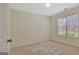 Bright bedroom with a neutral color palette and a large window at 40 Riverside Pkwy, Sharpsburg, GA 30277