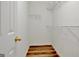 Walk-in closet with custom shelving and wood floors at 40 Riverside Pkwy, Sharpsburg, GA 30277