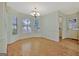 Dining area with chandelier and large windows that create ample natural light at 40 Riverside Pkwy, Sharpsburg, GA 30277