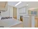 Well-lit kitchen with modern appliances, a breakfast bar, and light-colored cabinets at 40 Riverside Pkwy, Sharpsburg, GA 30277