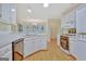 Open kitchen with stainless steel dishwasher and modern appliances at 40 Riverside Pkwy, Sharpsburg, GA 30277