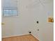 Functional laundry room with a window and hook-ups for washer and dryer at 40 Riverside Pkwy, Sharpsburg, GA 30277