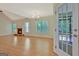 Living area featuring brick fireplace, access to outdoor area, and bright light at 40 Riverside Pkwy, Sharpsburg, GA 30277