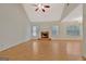 Bright, open living room with a vaulted ceiling, hardwood floors, and fireplace at 40 Riverside Pkwy, Sharpsburg, GA 30277