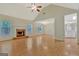 Expansive living room featuring a brick fireplace, and hardwood floors at 40 Riverside Pkwy, Sharpsburg, GA 30277