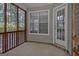 Relaxing screened porch offers natural light and a peaceful view of the surrounding greenery at 40 Riverside Pkwy, Sharpsburg, GA 30277