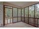Enclosed screen porch featuring a view of a private, wooded backyard at 40 Riverside Pkwy, Sharpsburg, GA 30277
