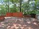 Large back deck, perfect for entertaining, with views of the wooded backyard and surrounding greenery at 2306 Old Lower River Rd, Douglasville, GA 30135