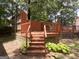 Inviting wood back deck with stairs and railing, perfect for outdoor gatherings and enjoying the peaceful surroundings at 2306 Old Lower River Rd, Douglasville, GA 30135