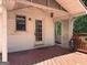 The back porch features a door to the home and a railing, offering a relaxing outdoor space at 2306 Old Lower River Rd, Douglasville, GA 30135