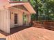 Charming back porch with access to the home, overlooking the spacious backyard and its natural beauty at 2306 Old Lower River Rd, Douglasville, GA 30135