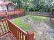 Backyard view with fire pit and spacious outdoor area is perfect for entertaining and relaxing outdoors at 2306 Old Lower River Rd, Douglasville, GA 30135