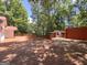 Expansive outdoor deck with space for entertaining, connecting to additional structures within a lush wooded setting at 2306 Old Lower River Rd, Douglasville, GA 30135