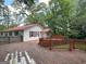 Back deck view reveals an outdoor entertainment area, with lush backyard greenery and relaxing ambiance at 2306 Old Lower River Rd, Douglasville, GA 30135