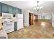 Open floor plan view of kitchen with tile floor leading to living room at 2306 Old Lower River Rd, Douglasville, GA 30135