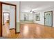 Bright living room featuring hardwood floors, neutral walls, natural light, and a ceiling fan at 2306 Old Lower River Rd, Douglasville, GA 30135