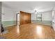 Spacious living room with beautiful wood flooring, a brick fireplace, and a large window to allow natural light at 2306 Old Lower River Rd, Douglasville, GA 30135