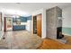 Open kitchen and living room floorplan, brick fireplace, and tile/wood floors at 2306 Old Lower River Rd, Douglasville, GA 30135