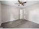 A standard bedroom with gray carpet, a ceiling fan, and doorway at 312 Cattlemans Cir, Mcdonough, GA 30252