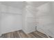 Walk-in closet with shelving units for ample storage and neutral paint, spacious for organization at 312 Cattlemans Cir, Mcdonough, GA 30252