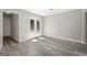 Dining area with wood floors with natural light entering through the double doors at 312 Cattlemans Cir, Mcdonough, GA 30252