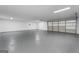 Spacious garage featuring sealed concrete floors, utility lighting, and ample room for vehicles and storage at 312 Cattlemans Cir, Mcdonough, GA 30252