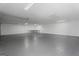 Large garage space with sealed concrete floors and utility lighting for ample storage at 312 Cattlemans Cir, Mcdonough, GA 30252
