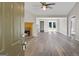 Bright living room with a fireplace, and lovely, light-colored wood floors at 312 Cattlemans Cir, Mcdonough, GA 30252