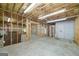 Partially finished basement with utilities, framing, and concrete floors at 110 Chardonnay Oaks Dr, Mcdonough, GA 30252