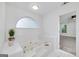 Relaxing bathroom features a soaking tub with jets and a view to the carpeted bedroom at 110 Chardonnay Oaks Dr, Mcdonough, GA 30252