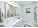 Bright bathroom features a granite countertop, tub, and large window at 110 Chardonnay Oaks Dr, Mcdonough, GA 30252