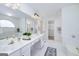 Bright bathroom features double vanity, large mirror, and separate tub and shower at 110 Chardonnay Oaks Dr, Mcdonough, GA 30252