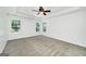 Large primary bedroom with tray ceiling and natural light at 110 Chardonnay Oaks Dr, Mcdonough, GA 30252