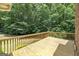 The deck has ample space for relaxing, offering scenic views of the lush backyard surroundings at 110 Chardonnay Oaks Dr, Mcdonough, GA 30252