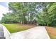 Charming brick home with a well-manicured lawn and mature trees creating a serene curb appeal at 110 Chardonnay Oaks Dr, Mcdonough, GA 30252