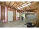 Unfinished garage with room for parking, storage, and working on home improvement projects at 110 Chardonnay Oaks Dr, Mcdonough, GA 30252