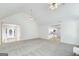 Spacious living room with plush carpet, access to entry, and view to the kitchen at 110 Chardonnay Oaks Dr, Mcdonough, GA 30252