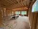 Unfinished interior showing the framing of the living space and natural light from windows at 333 Brookstone Dr, Carrollton, GA 30116