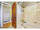 Bathroom featuring tile walls and a shower/tub combo at 3212 Georgian Woods Cir, Decatur, GA 30034