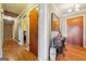 Hallway with hardwood flooring, showcasing neutral walls and decorative mirror at 3212 Georgian Woods Cir, Decatur, GA 30034