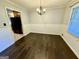Dining room featuring hardwood floors, paneled walls, and natural lighting at 1624 Hampton Locust Grove Rd, Locust Grove, GA 30248