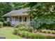 Charming home with a manicured lawn and inviting front porch at 1624 Hampton Locust Grove Rd, Locust Grove, GA 30248