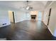 Living room with a stone fireplace, hardwood floors, and a trey ceiling with ceiling fan at 1624 Hampton Locust Grove Rd, Locust Grove, GA 30248