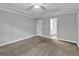 Bedroom with neutral walls, plush carpet, and a ceiling fan for comfort at 105 Rosewood Cir, Covington, GA 30016