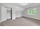 Bedroom with carpeted floors and a closet with built-in shelves at 105 Rosewood Cir, Covington, GA 30016